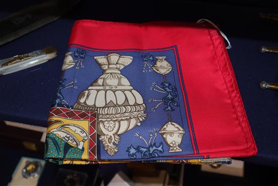 Two Hermes silk scarves, Le Tarot (red border) and Chasse en Inde (blue border),